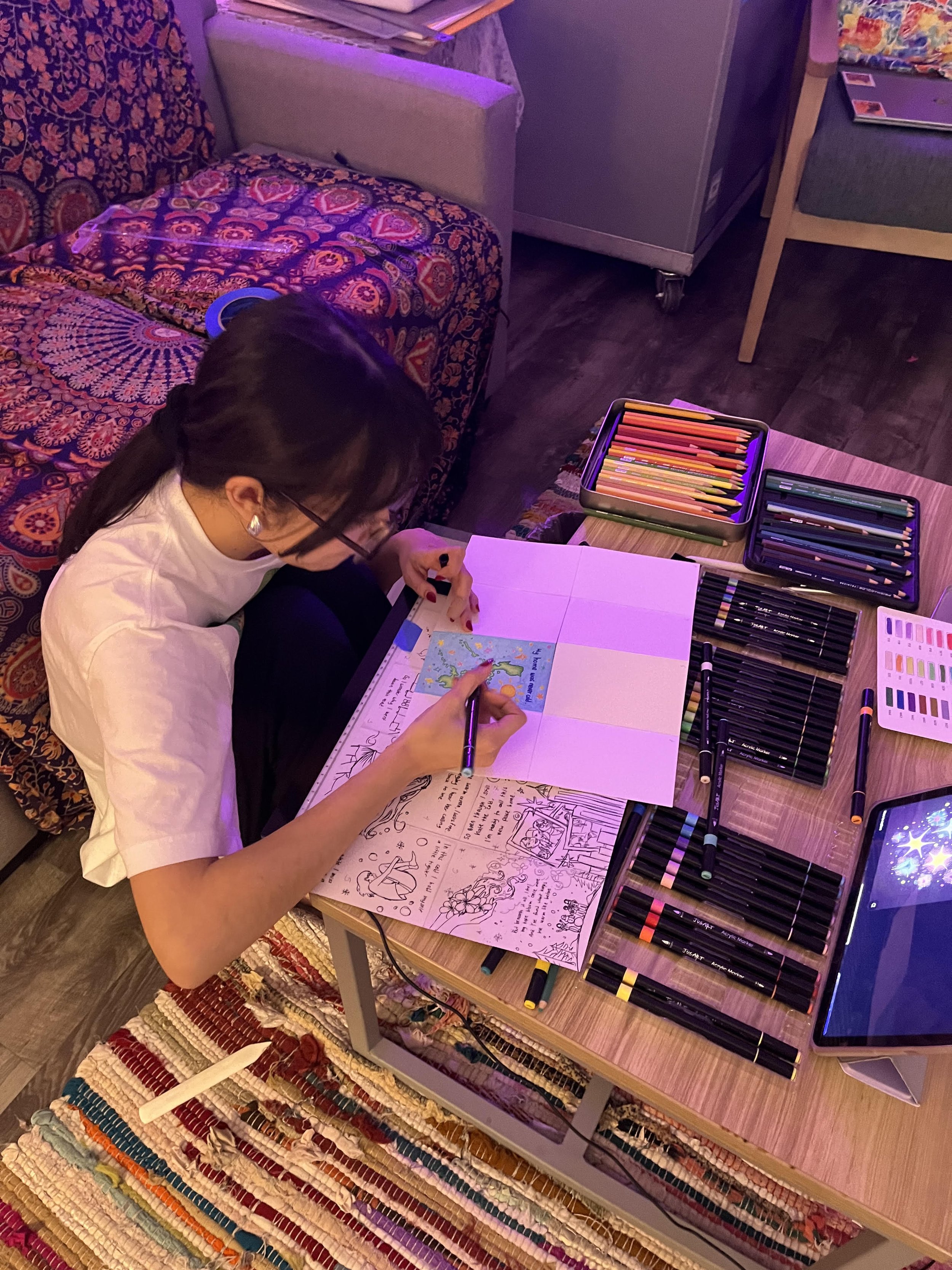 Maya de Alba drawing at her desk